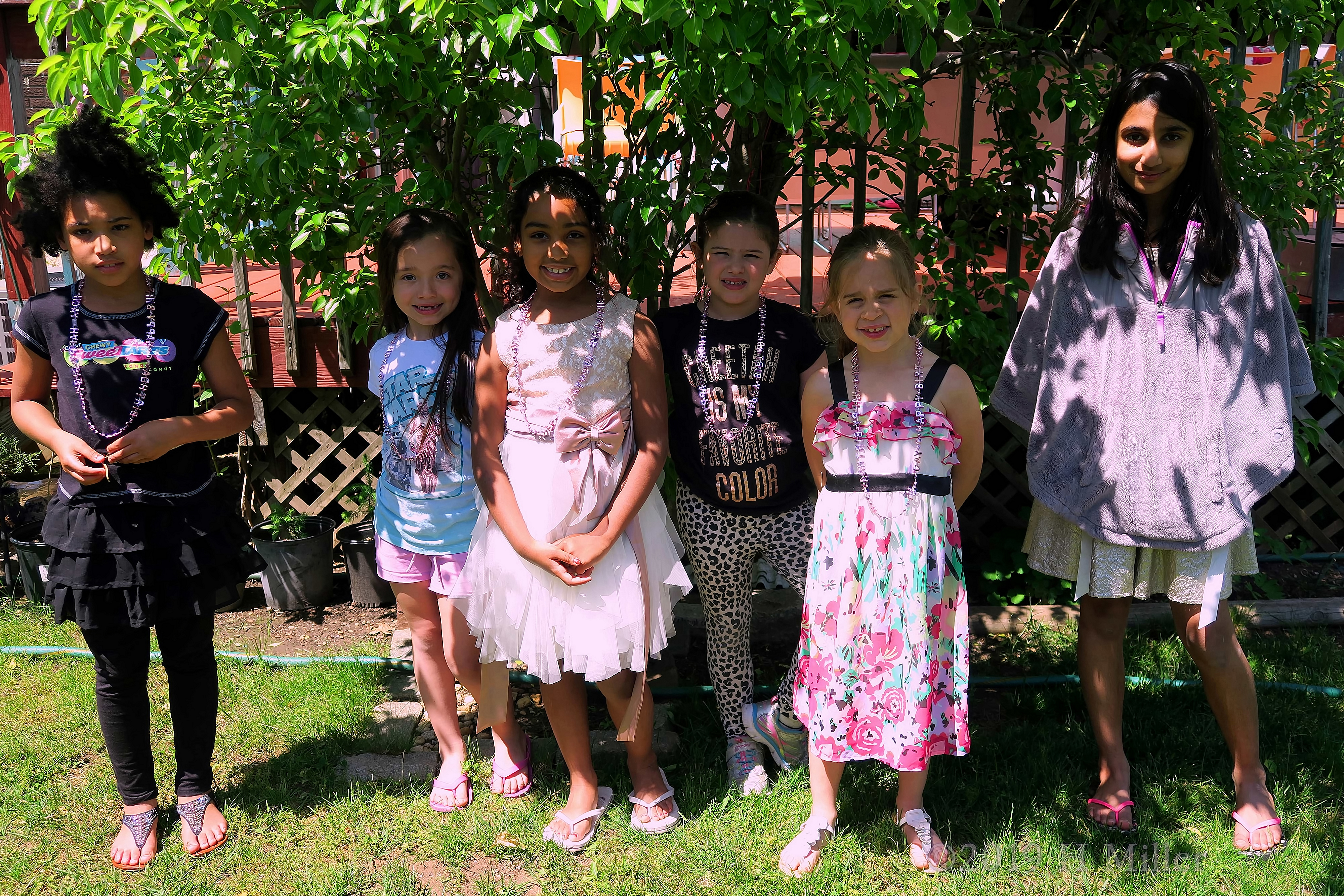 The Birthday Girl And Guests PoseFor The Cameras The Birthday Girl And Guests PoseFor The Cameras