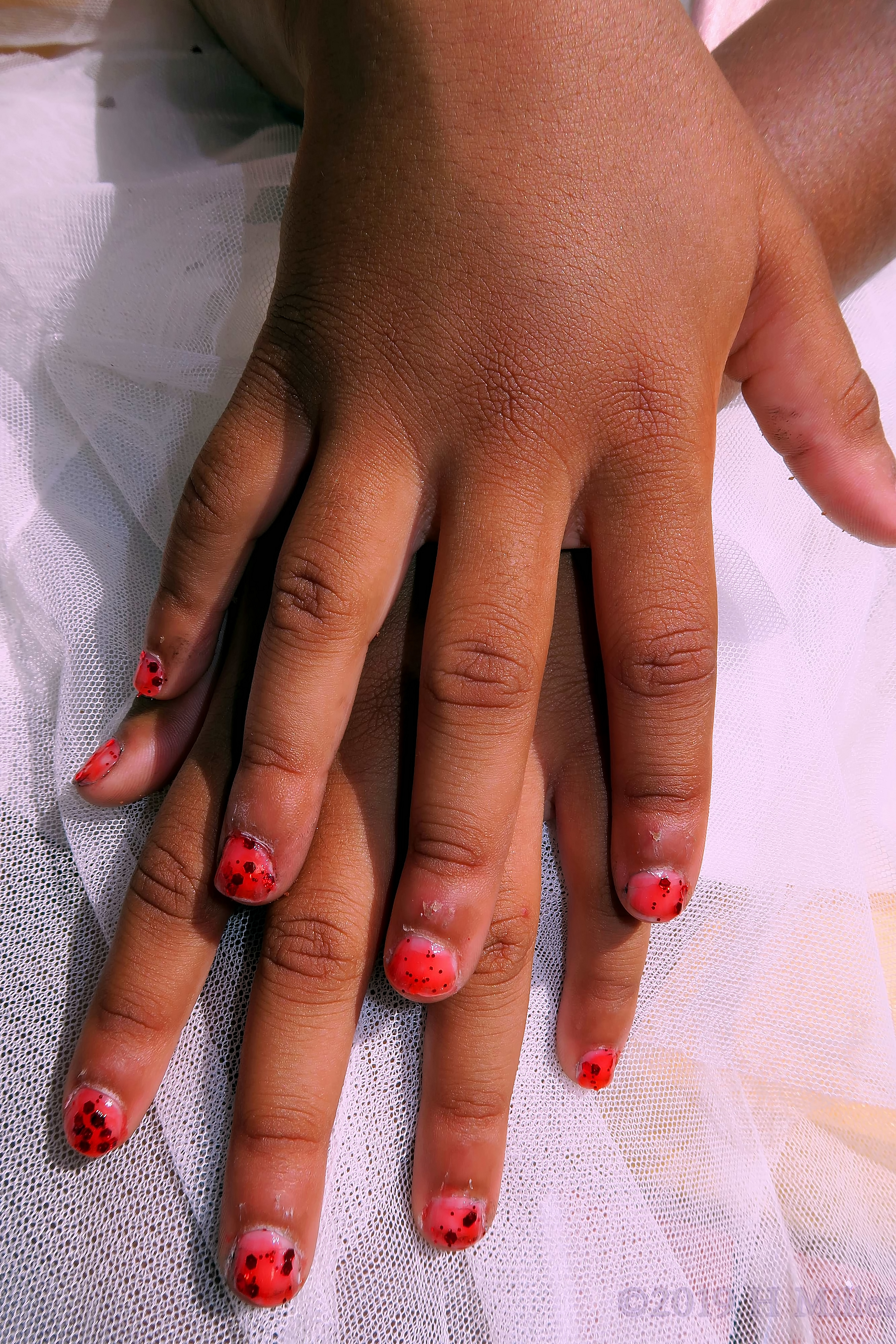 Vibrant Red Nail Coat With Dark Red Glitter For This Kids Manicure Vibrant Red Nail Coat With Dark Red Glitter For This Kids Manicure