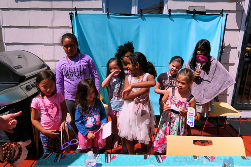 Birthday Girl And Guests Having Fun At The Outdoor Photo Booth Birthday Girl And Guests Having Fun At The Outdoor Photo Booth