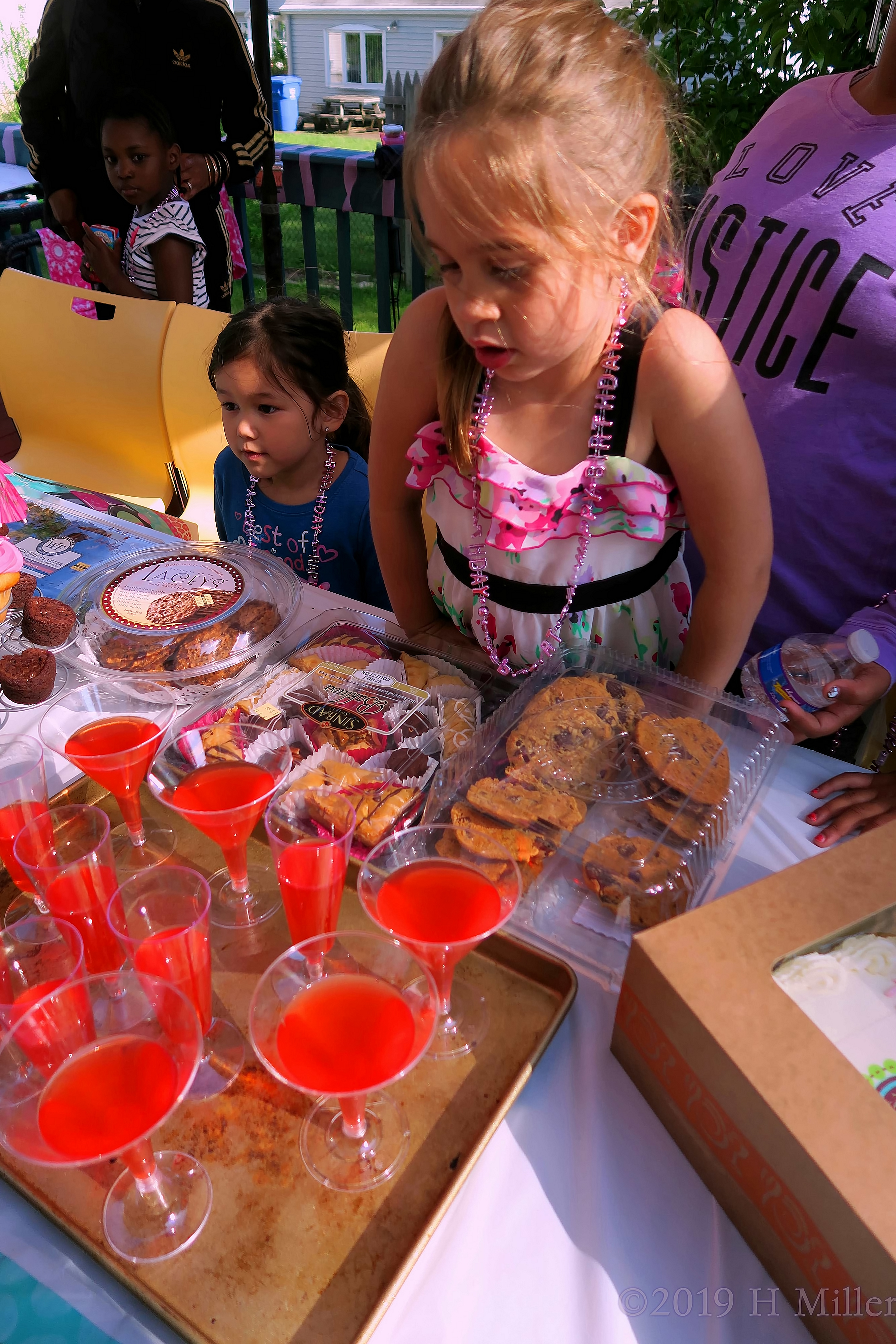 An Assortment Of Sweet Treats And Cool Beverages In Champagne Glassess An Assortment Of Sweet Treats And Cool Beverages In Champagne Glassess