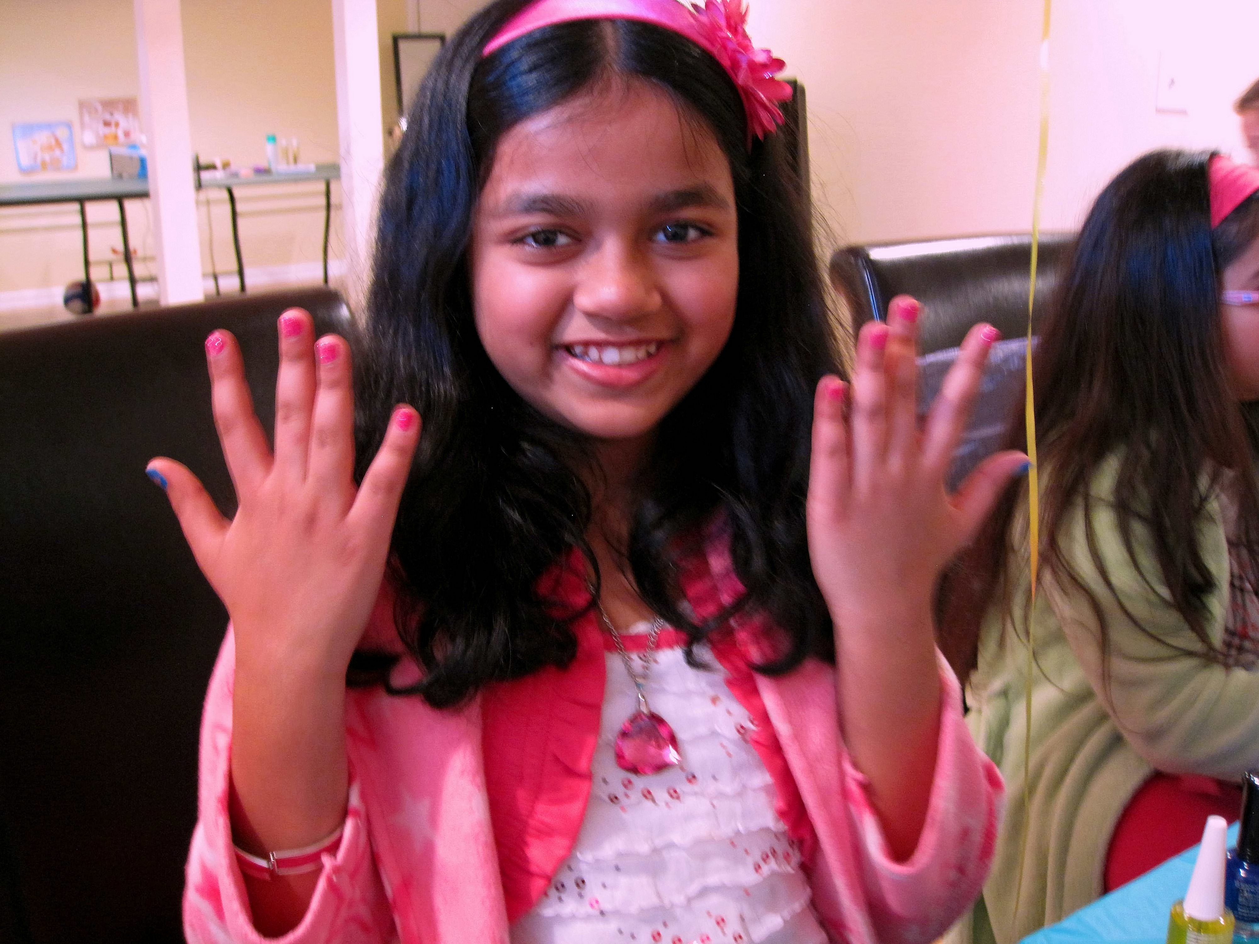 Smiling Big About Her Kids Manicure 