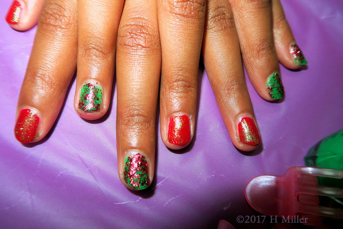 Showing Off Her Awesome Red And Green Mani With Red And Green Glitter Nail Polish. 