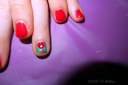 Shiny And Glittery Holly Berry Nail Design.