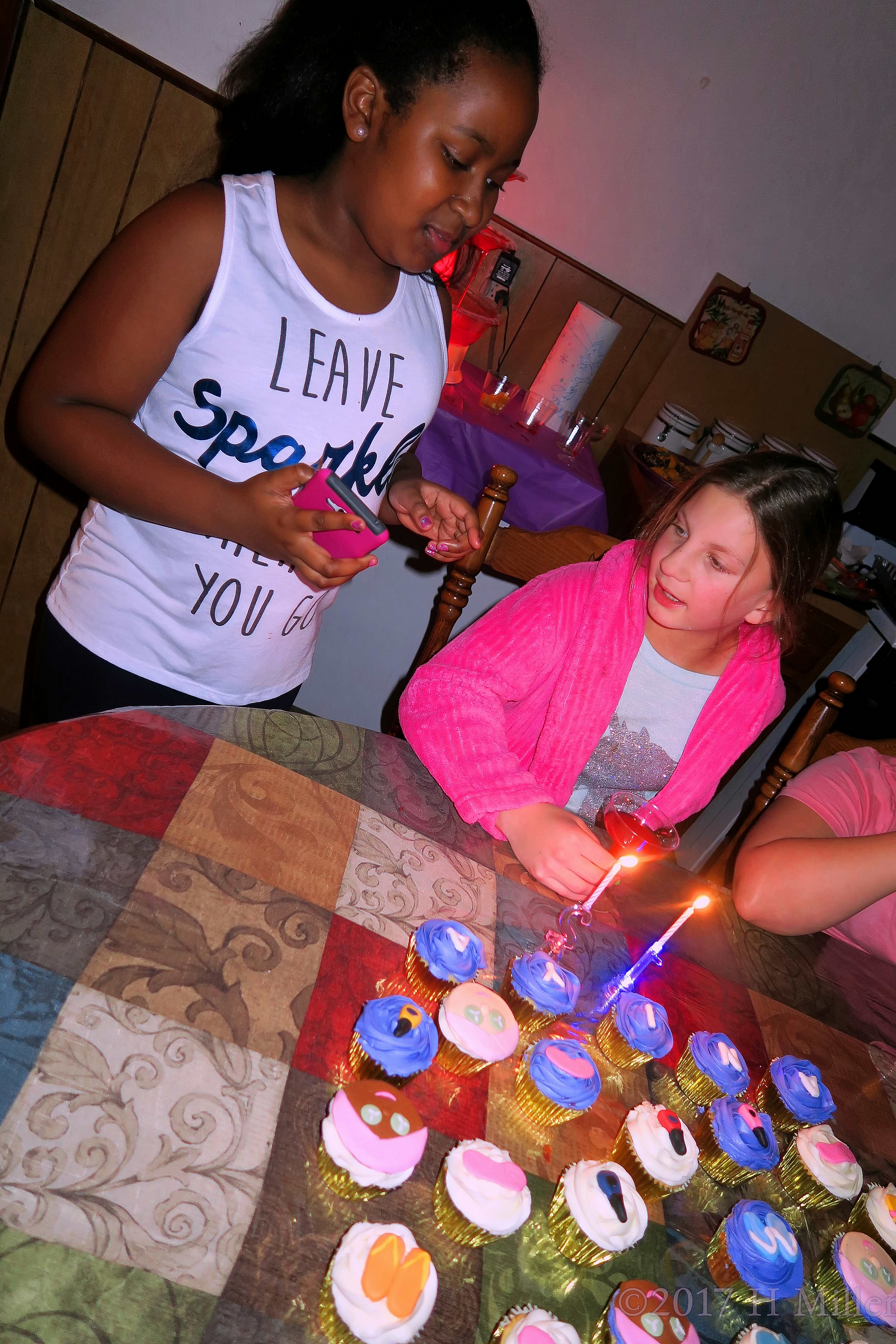 Lighting Candles On The Birthday Cupcakes 