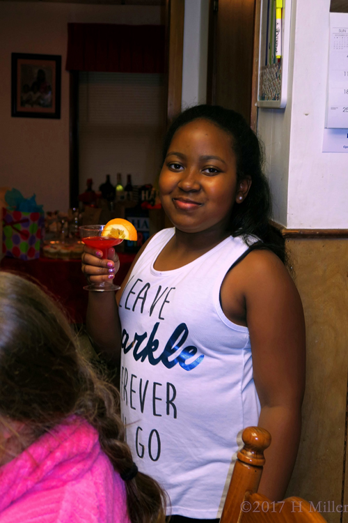 Birthday Girl Holds The Refreshment Cup For A Toast And Smiles. Birthday Girl Holds The Refreshment Cup For A Toast And Smiles.
