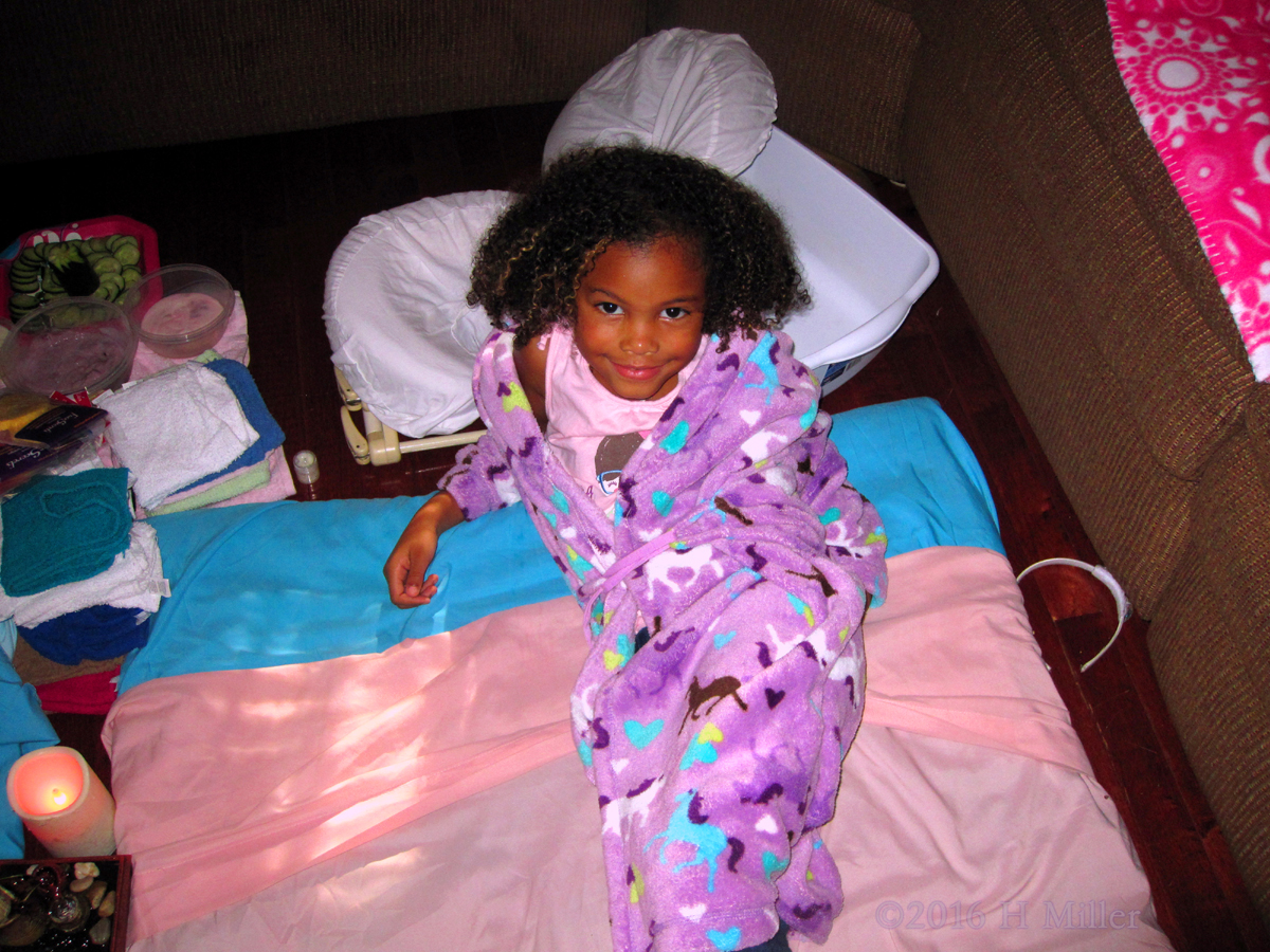 Purple Horses Spa Robe On This Party Guest As She Relaxes In The Kids Facial And Massage Area 