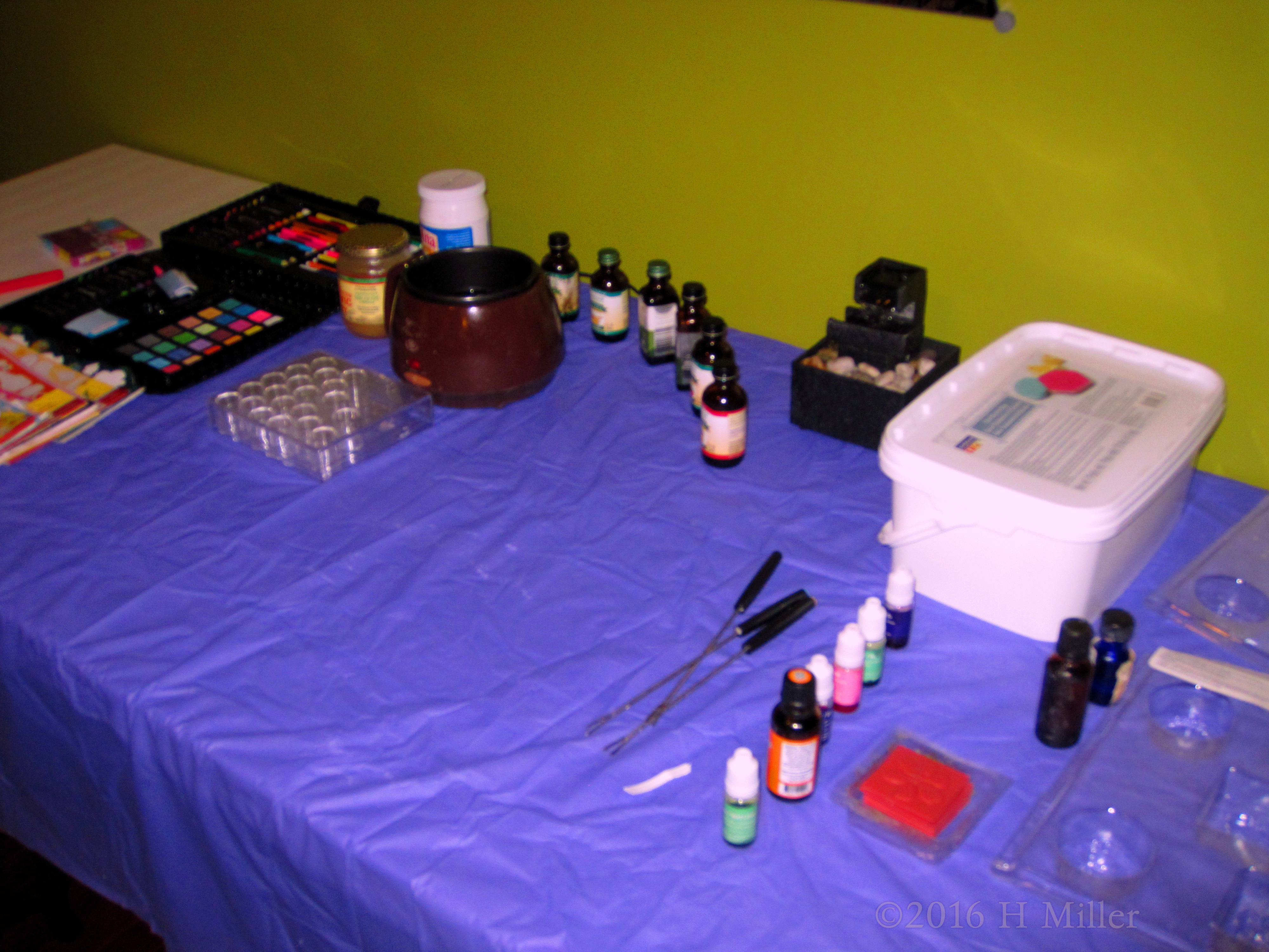 Many Kids Crafts Supplies On A Blue Covered Table Many Kids Crafts Supplies On A Blue Covered Table