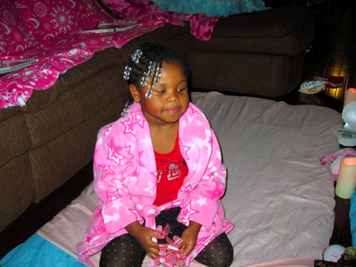 Pink Star Spa Robe On This Party Guest While She Sits On The Spa Mat Waiting For Her Nails To Dry. Pink Star Spa Robe On This Party Guest While She Sits On The Spa Mat Waiting For Her Nails To Dry.