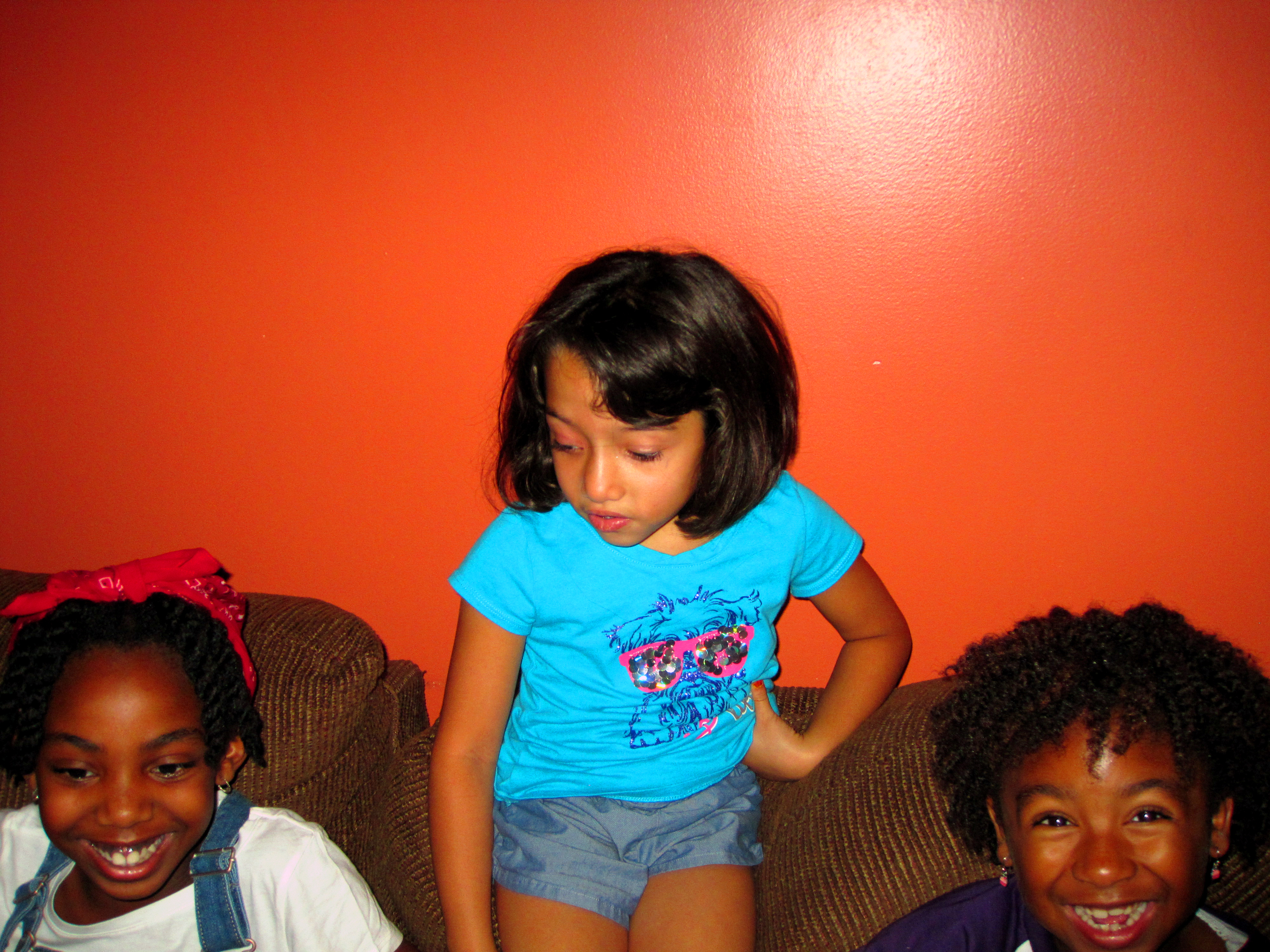 Three Spa Girls In Front Of Orange Wall Three Spa Girls In Front Of Orange Wall