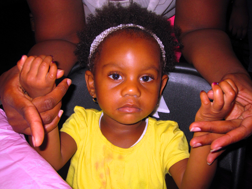 Little Spa Girl Holding Up Her Hands. She Is Ready For Her Kids Manicure! Little Spa Girl Holding Up Her Hands. She Is Ready For Her Kids Manicure!