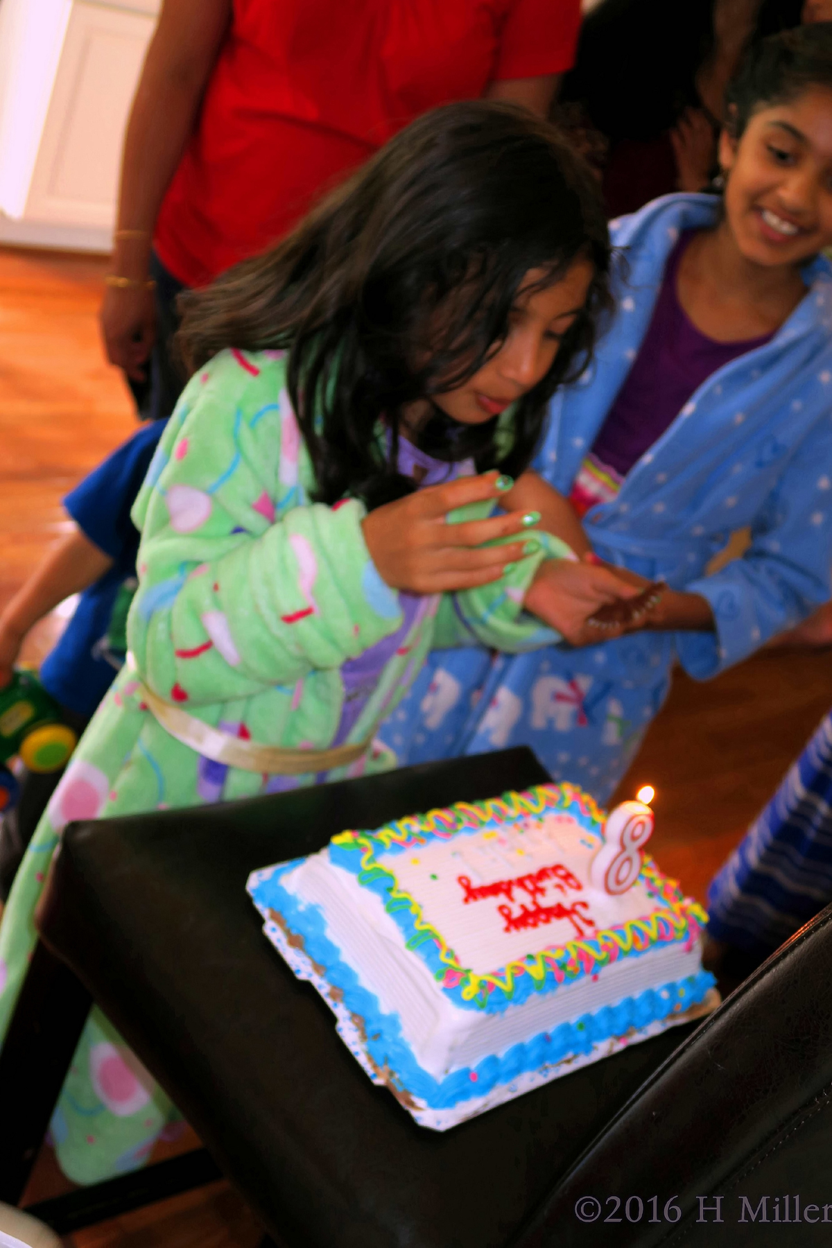 Checking Out The Kids Birthday Cake. 