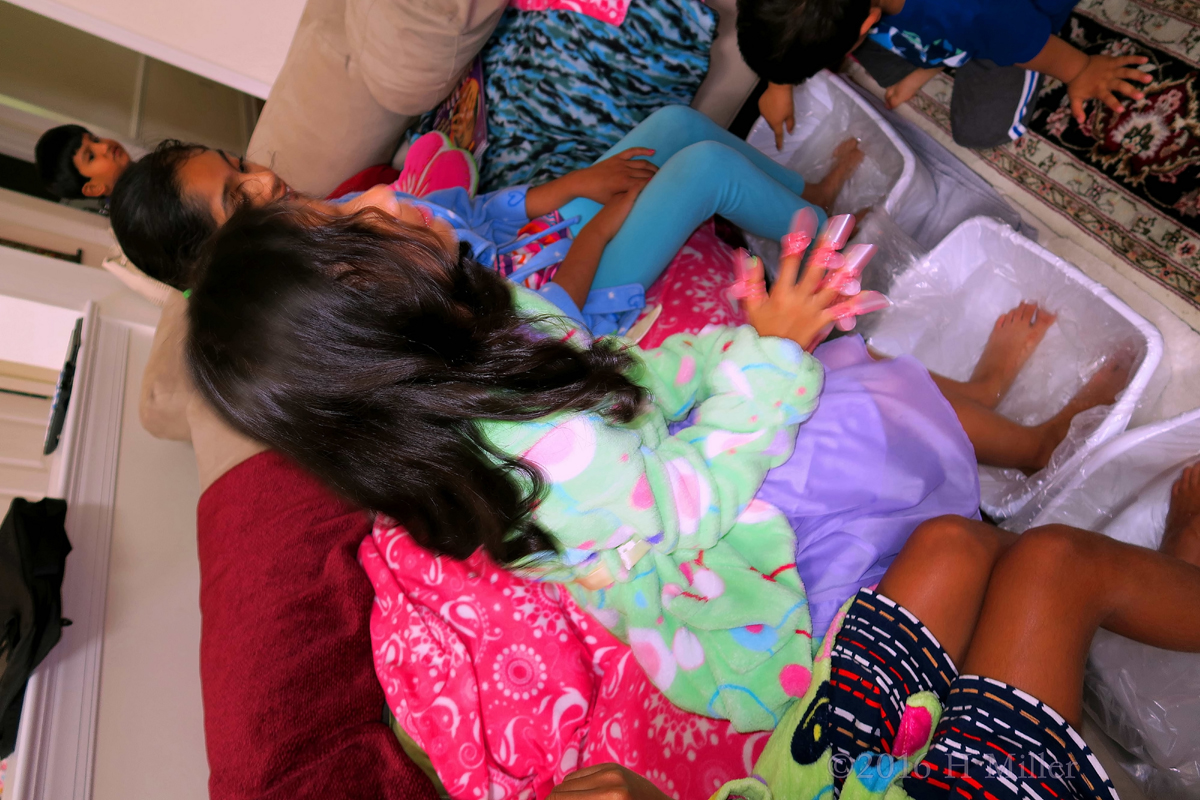 Hanging Out And Chatting During Kids Pedicure Footbaths. 