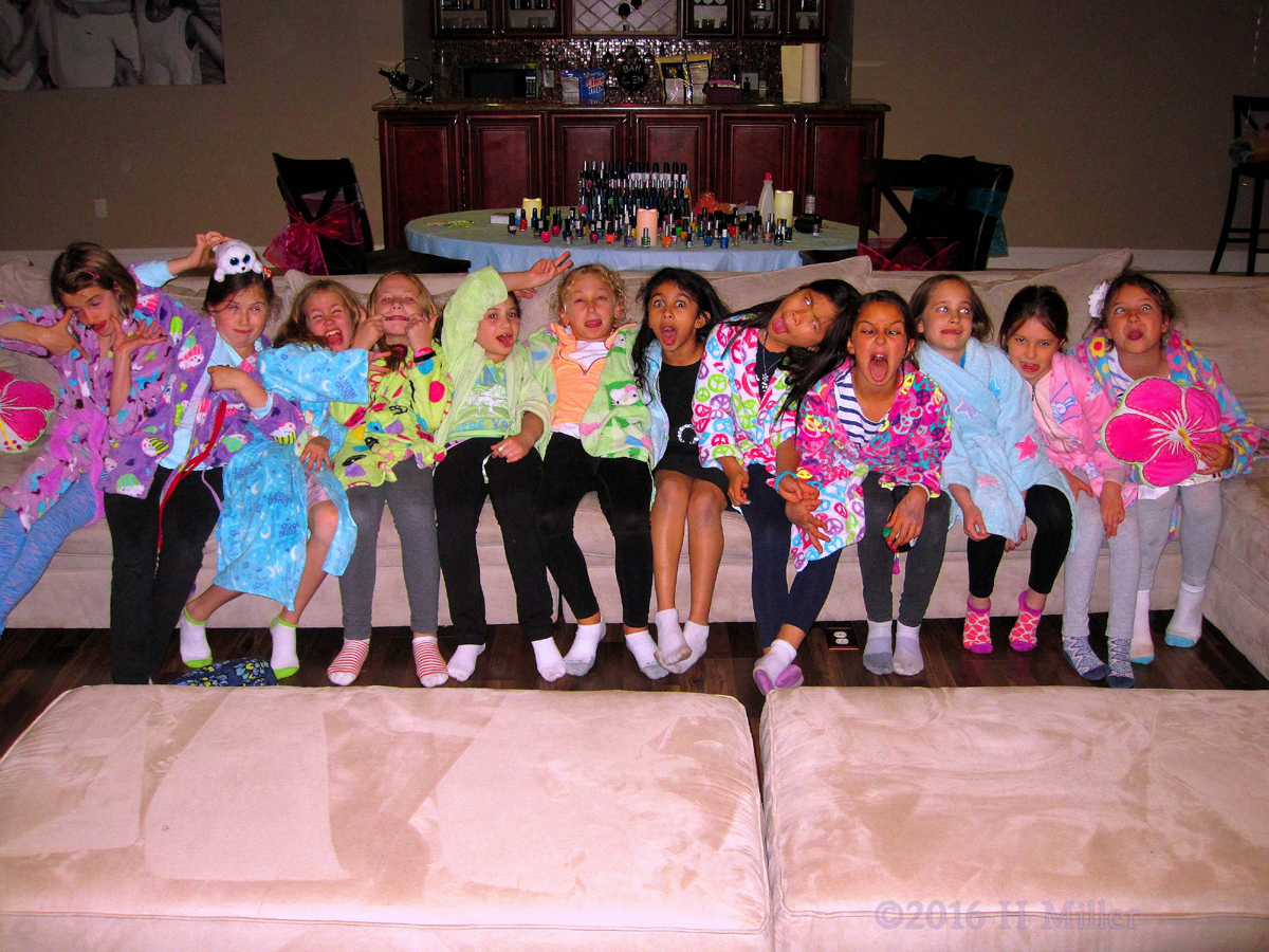 Ashley And Her Friends Making Silly Faces While Wearing Their Spa Party Robes. 