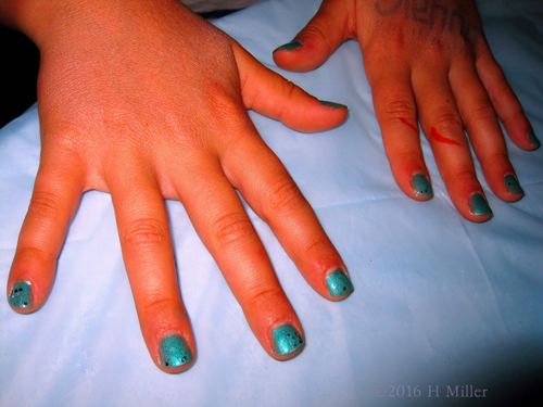 Metallic Cyan Nail Polish With Dark Glitter Top Coat. Metallic Cyan Nail Polish With Dark Glitter Top Coat.