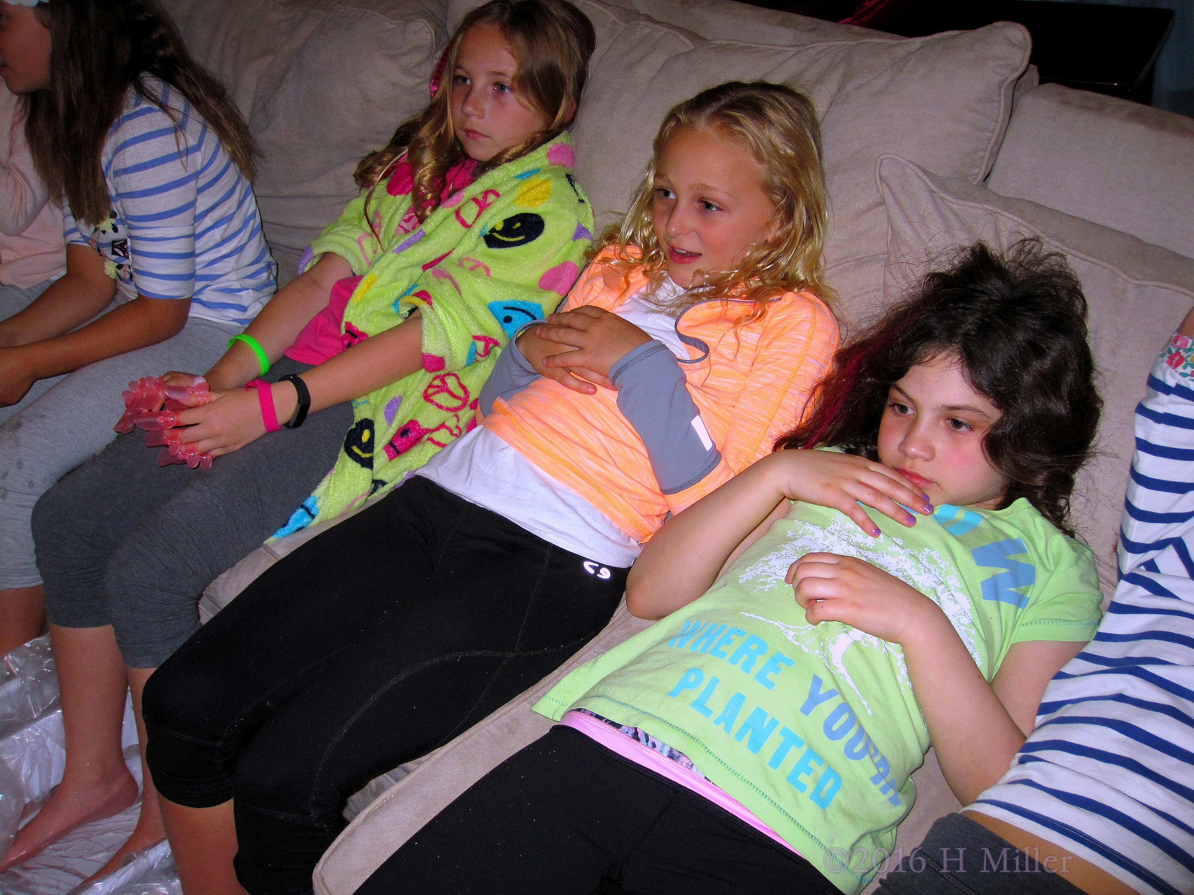 Leaning Back As Their Feet Soak, The Girls Enjoy The Scent Of The Warm Water. Leaning Back As Their Feet Soak, The Girls Enjoy The Scent Of The Warm Water.