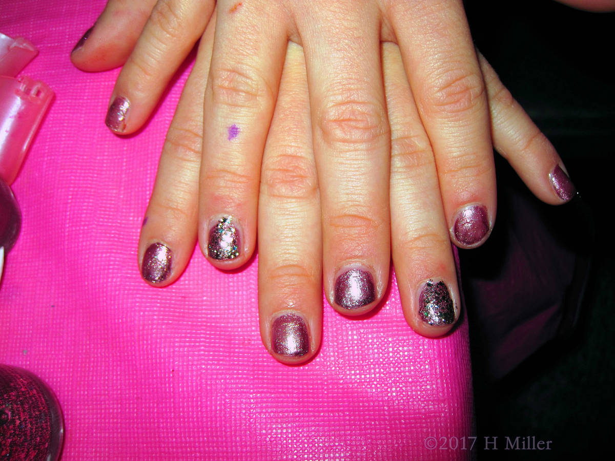 She Chose A Lovely Shade Of Metallic Purple For Her Manicure. 