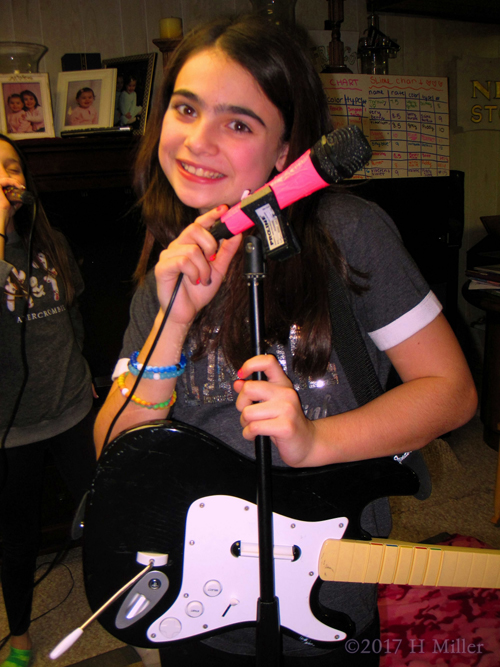 Audrey Pauses During Singing To Smile For The Camera. 