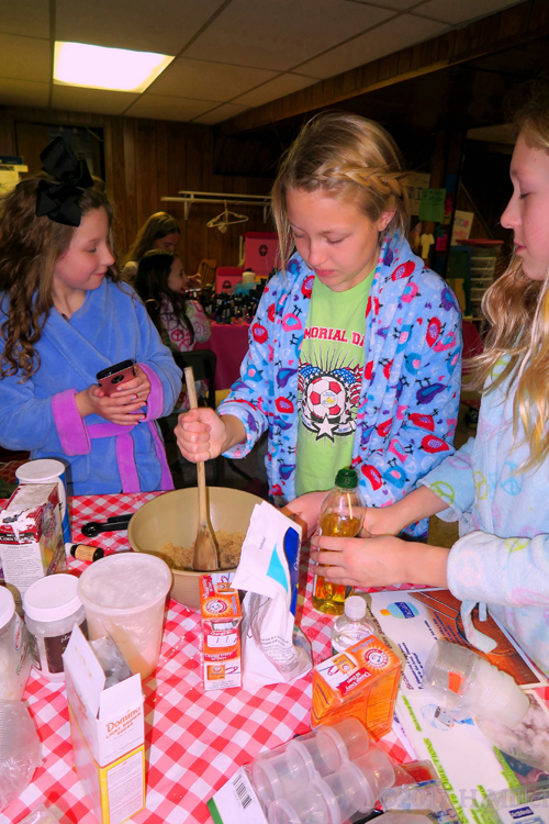 Carefully Measuring Olive Oil For The Sugar Scrub Kids Craft!