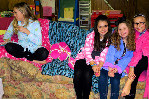 Hanging Out Together On The Spa Couch In Their Spa Robes. Hanging Out Together On The Spa Couch In Their Spa Robes.