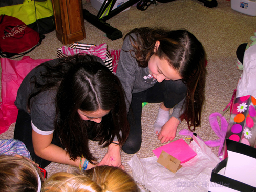 Reading The Card With Her Gifts. 