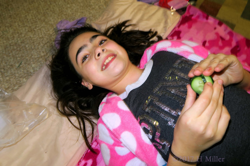 Smiling, Still Holding Her Cukes After Her Facial Treatment. Smiling, Still Holding Her Cukes After Her Facial Treatment.