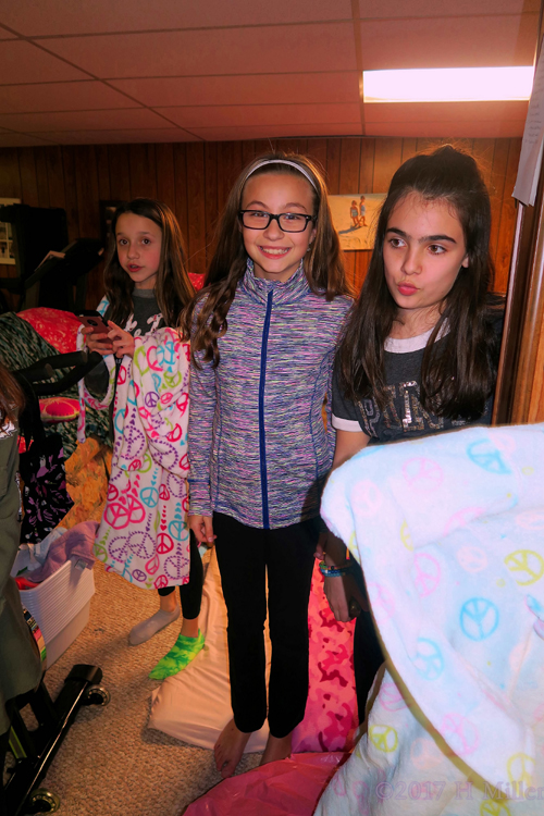 The Birthday Girl And Her Friends Are Choosing Their Spa Robes. The Birthday Girl And Her Friends Are Choosing Their Spa Robes.