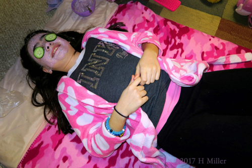 The Birthday Girl Relaxes With Cukes On Her Eyes. The Birthday Girl Relaxes With Cukes On Her Eyes.
