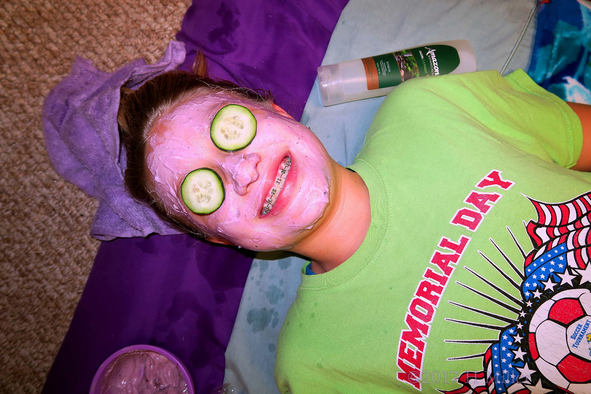 Smiling During Her Kids Face Masque. 