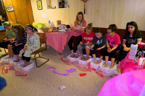 A Long View Of Everyone Sitting Together For Their Kids Pedicures! 