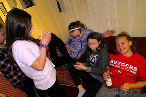 Everyobody Is Hanging Out On Their Phones During The Kids Party. Everyobody Is Hanging Out On Their Phones During The Kids Party.