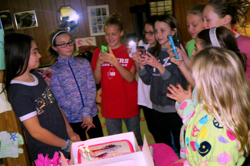 Everyone Gathers Around The Spa Birthday Cake For A Photo Of The Birthday Girl!