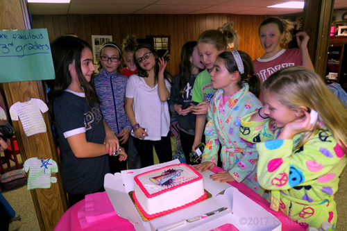 Gathered Around The Spa Cake, Getting Ready To Enjoy Eating Cake! Gathered Around The Spa Cake, Getting Ready To Enjoy Eating Cake!