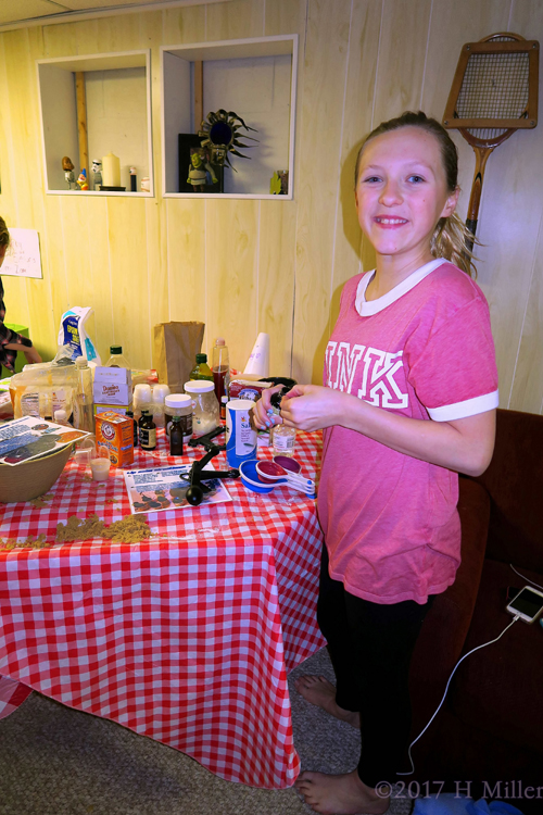 She Is Making The Flavored Lip Balm Craft At The Girls Spa!