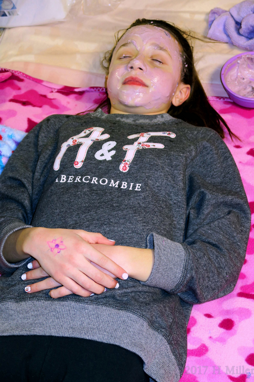 Smiling And Relaxing During The Face Masque Part Of Her Kids Facial. Smiling And Relaxing During The Face Masque Part Of Her Kids Facial.