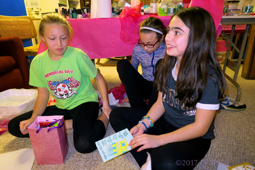 The Birthday Girl Opens Her Card. The Birthday Girl Opens Her Card.