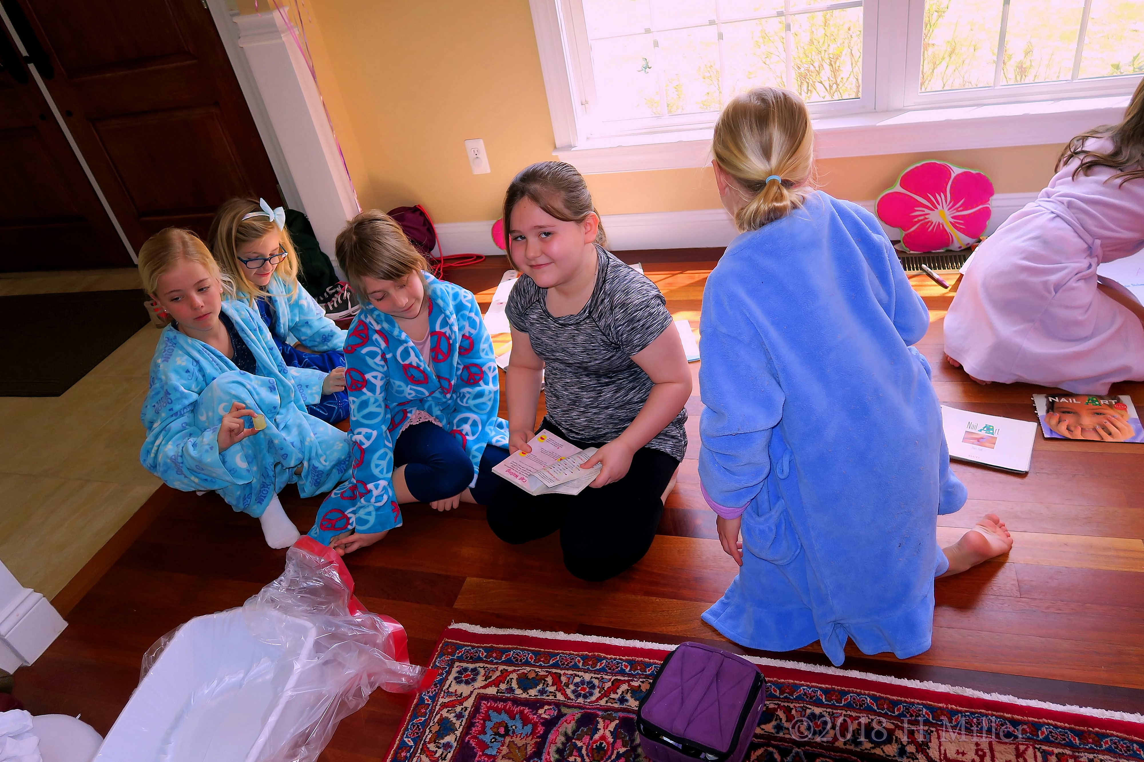 Checking Out The Nail Designs Books While Waiting For Their Girls Manicures. Checking Out The Nail Designs Books While Waiting For Their Girls Manicures.