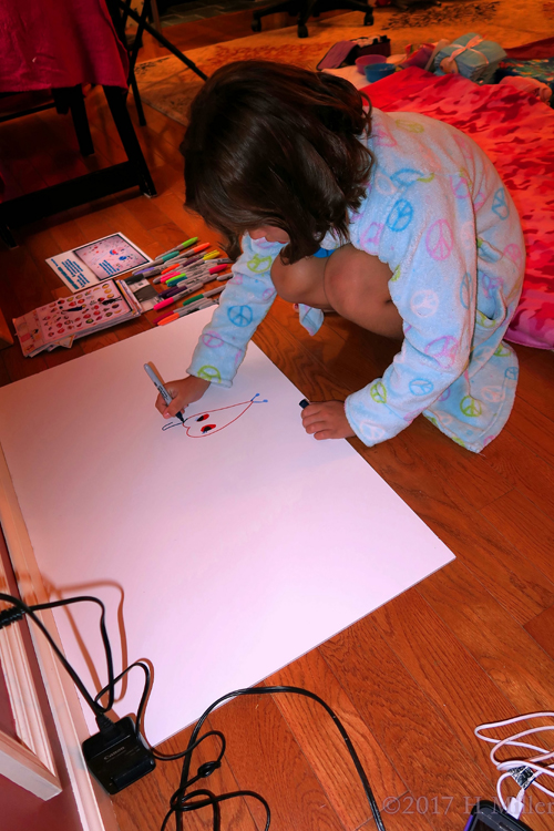 Ava's Friend Is Writing On The Spa Birthday Card.