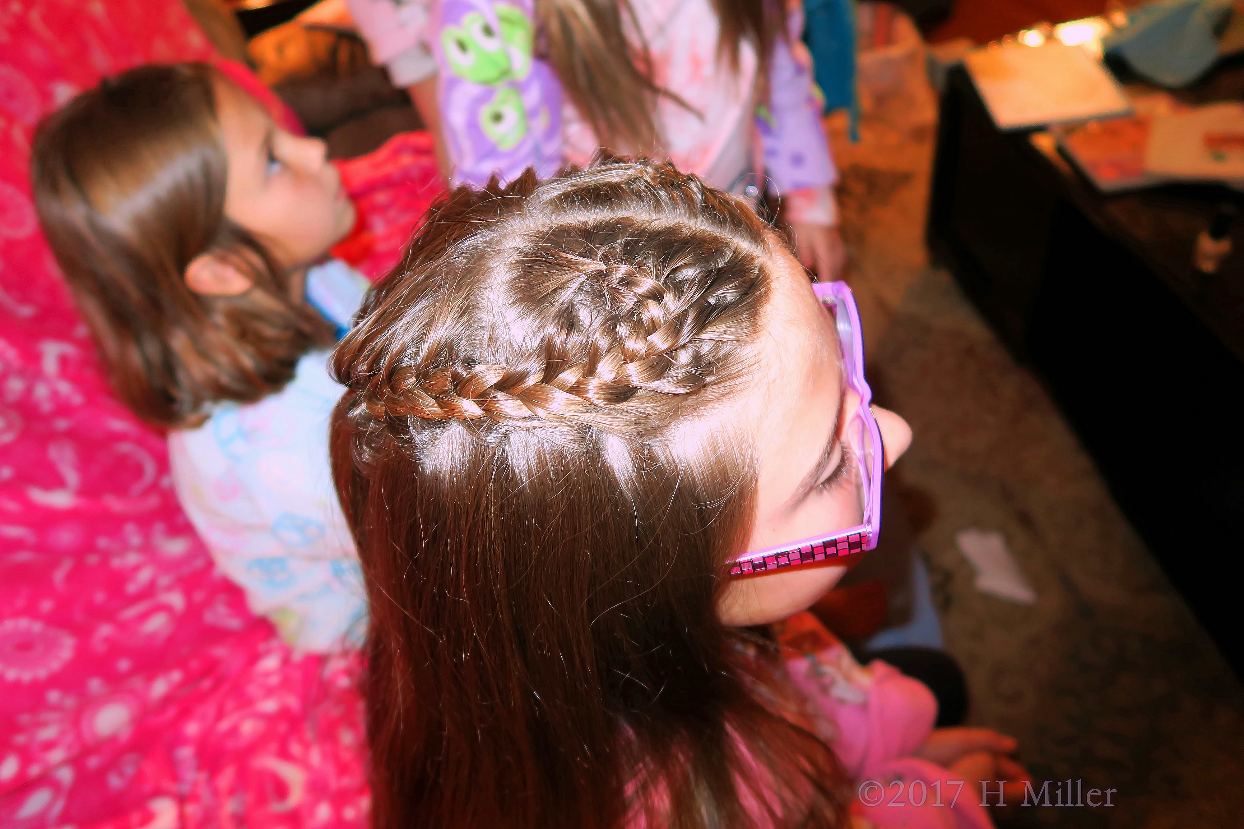 Close Up Of A Great Heart Shaped Braided Hairstyle For Girls. 