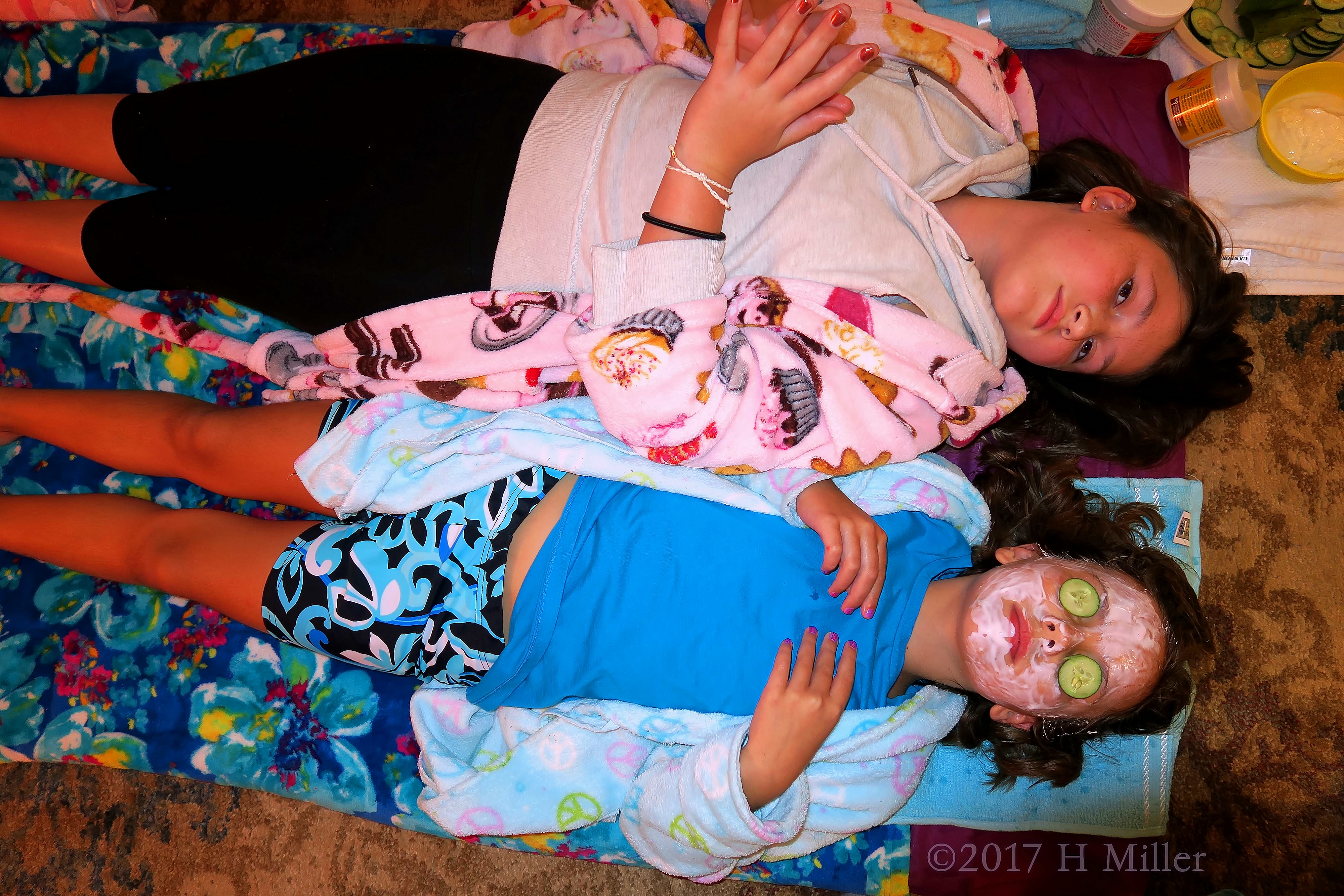 Girls Lying Side By Side For Girls Facials. Girls Lying Side By Side For Girls Facials.