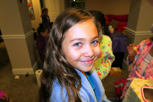 Light Blue Robed Spa Guest Smiling For The Camera Light Blue Robed Spa Guest Smiling For The Camera