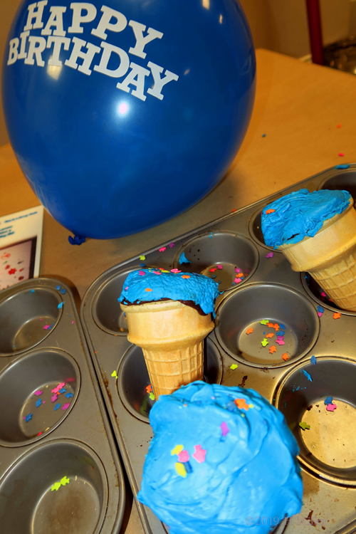 Blue Balloons And Blue Cream Frosting On Cupcake Cones!