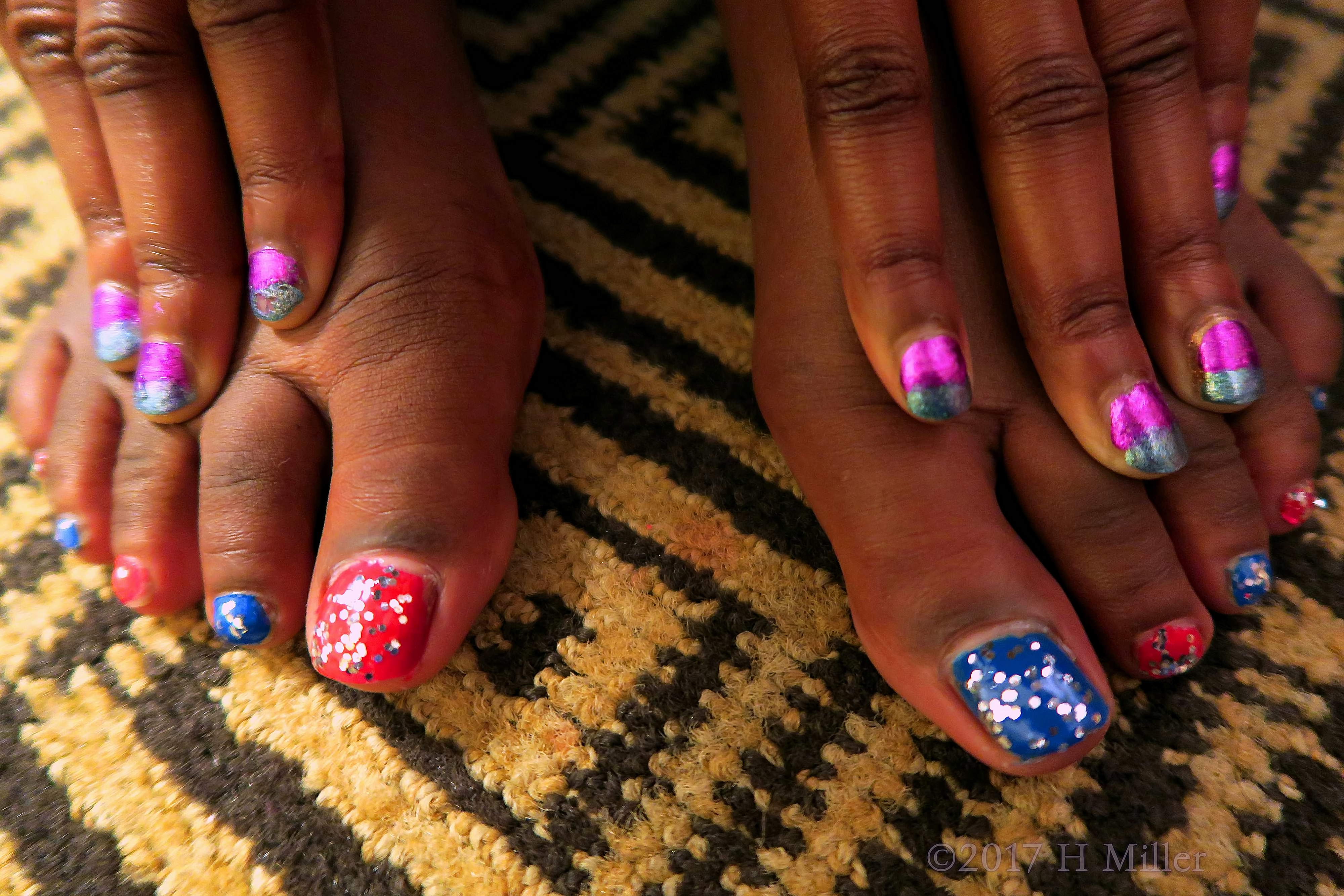 A Close Up Of The Super Shiny Kids Pedicure And Ombre Girls Mani. 