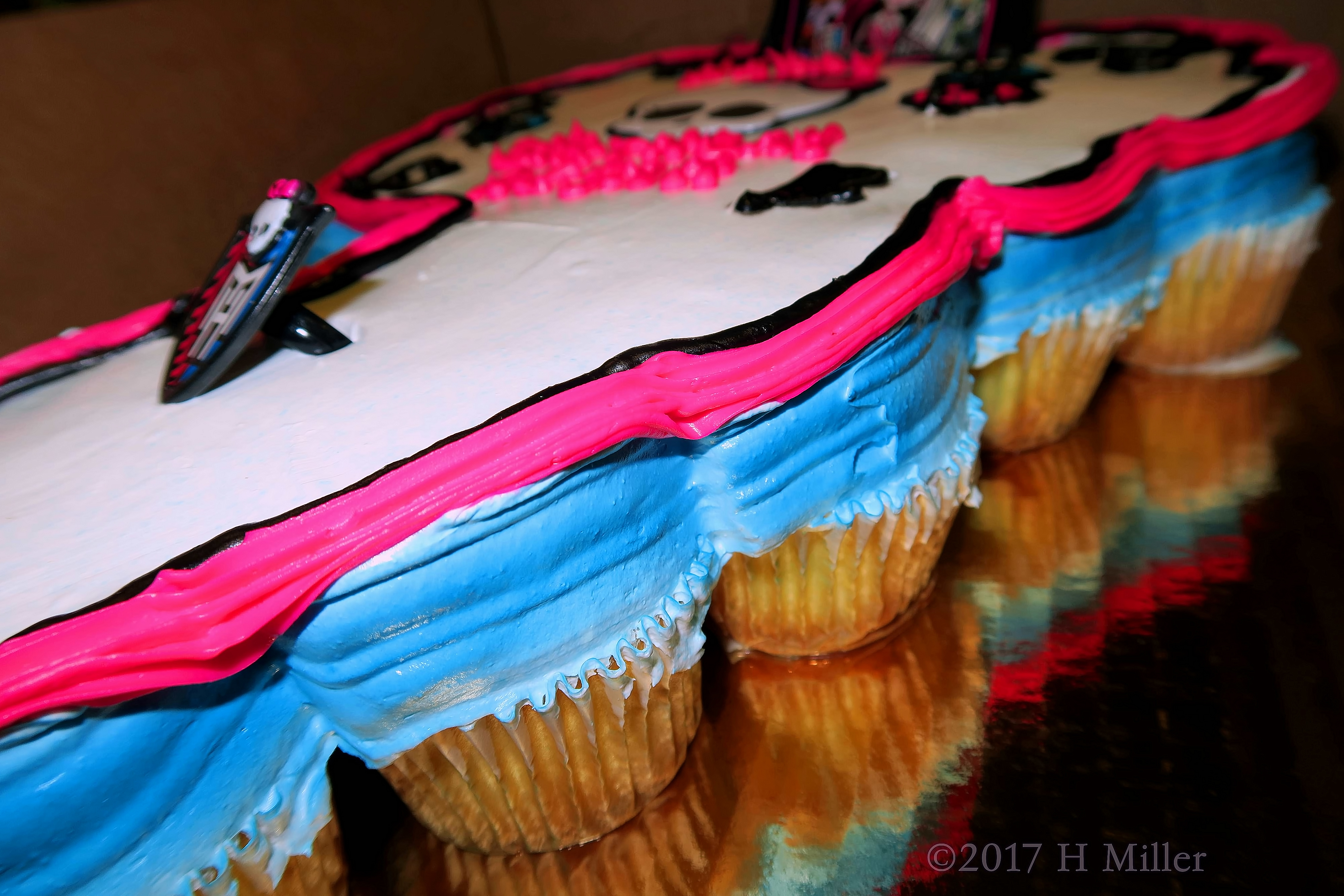 A Side View Of The Frosted Birthday Cupcakes 
