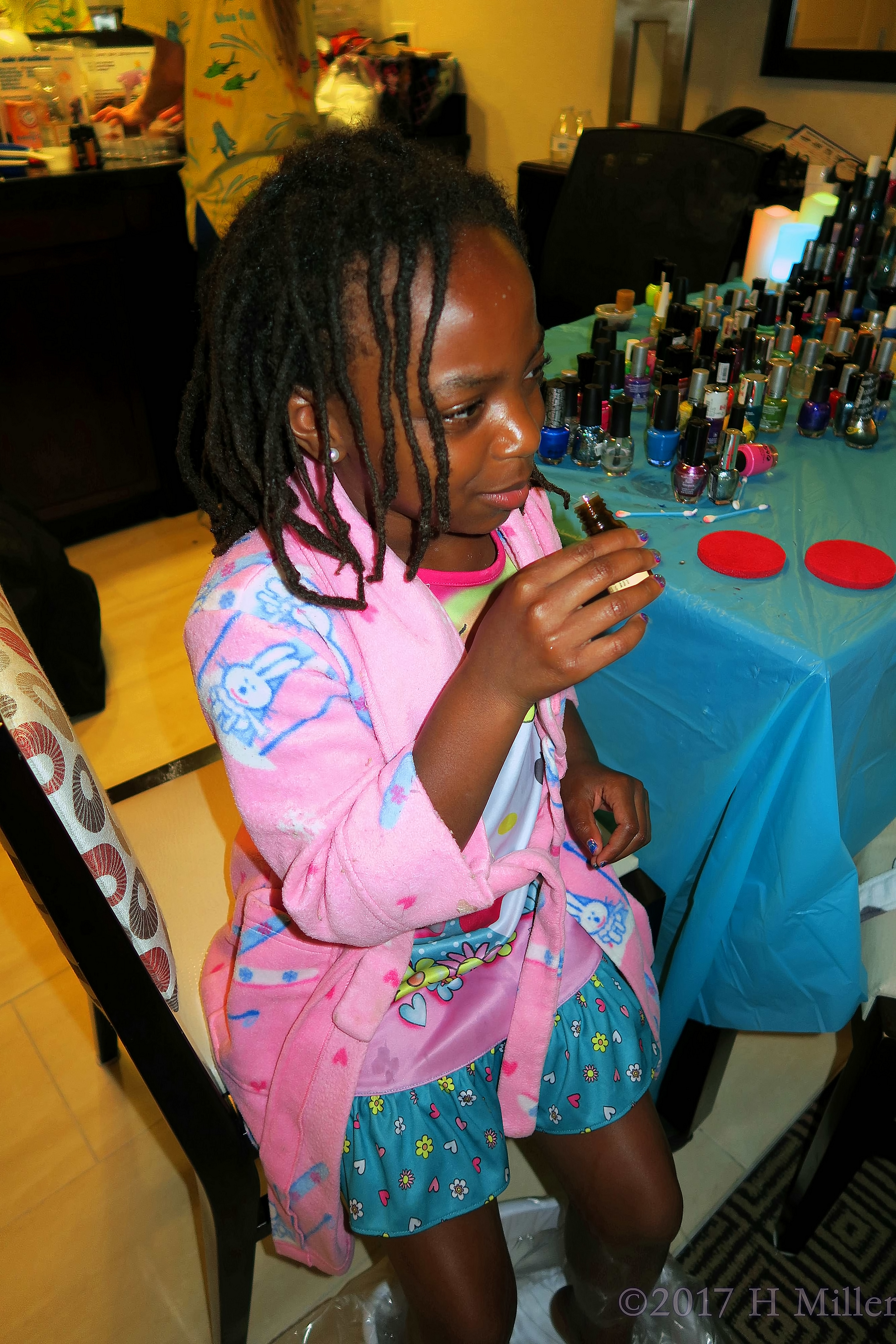 Smelling The Essential Oil For Her Kids Pedicure Footbath. Smelling The Essential Oil For Her Kids Pedicure Footbath.
