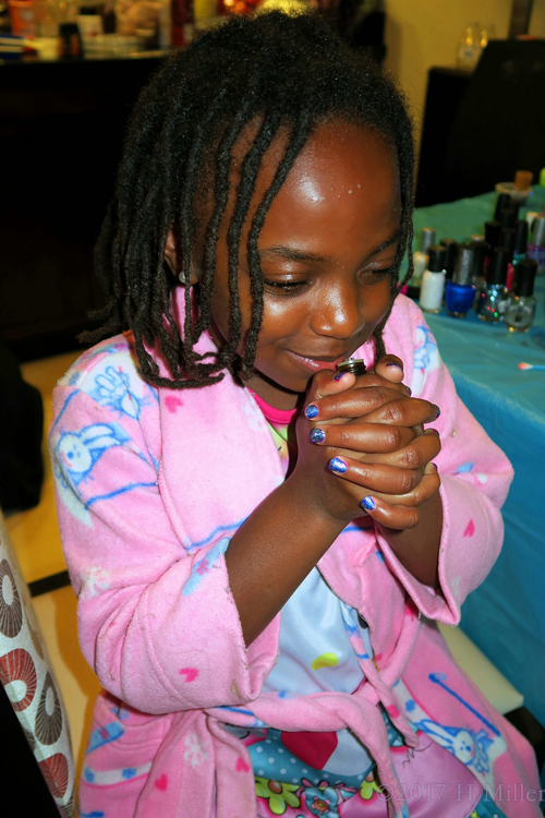 Taking Another Smell Of The Essential Oil For Her Kids Pedicure. Taking Another Smell Of The Essential Oil For Her Kids Pedicure.