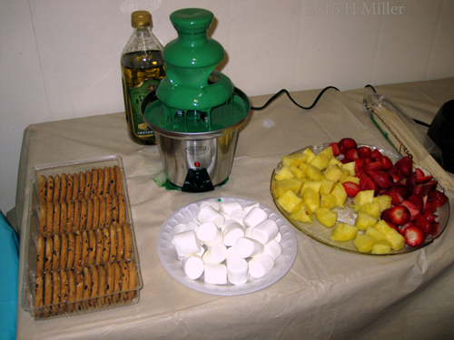 Chocolate Fountain With Cookies Fruit And Marshmallows