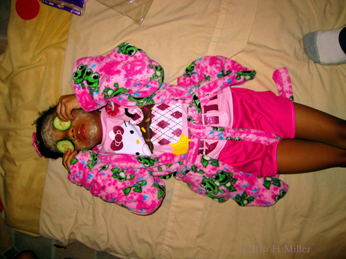 Adjusting Her Cucumbers During Her Kids Facial Adjusting Her Cucumbers During Her Kids Facial