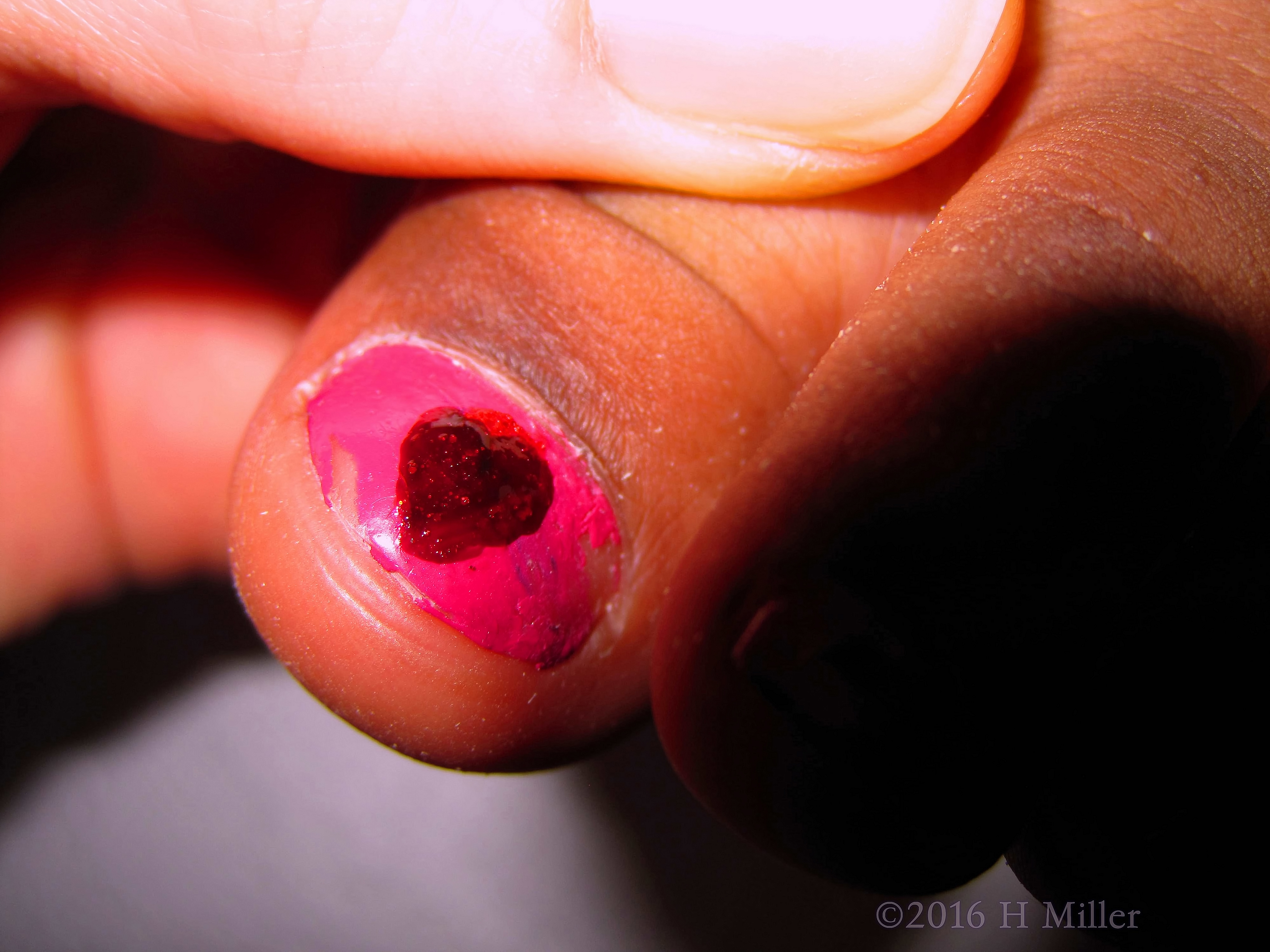 She Has An Adorable Heart On Her Nail!