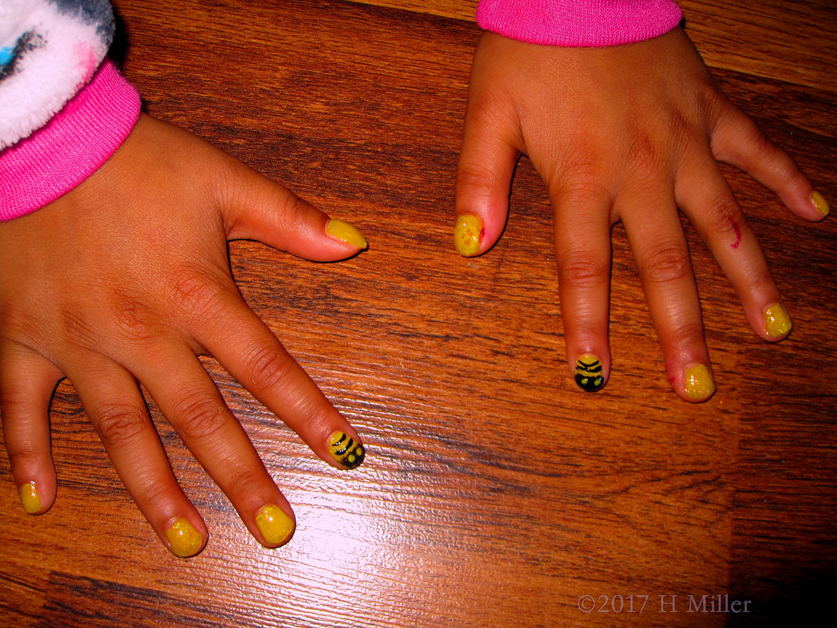 Yellow Nail Polish With Black Bee Nail Design Makes A Cool Manicure For Kids! 