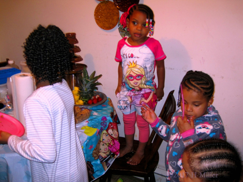 Briana And Her Friends Enjoy The Snacks At The Table! Briana And Her Friends Enjoy The Snacks At The Table!